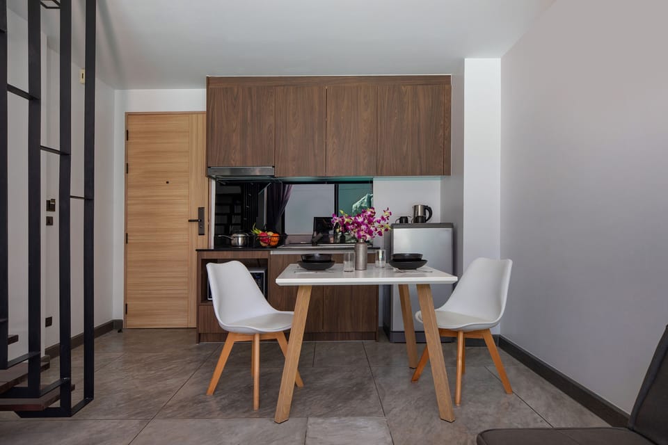 Exclusive Apartment, Balcony, Pool View | In-room dining