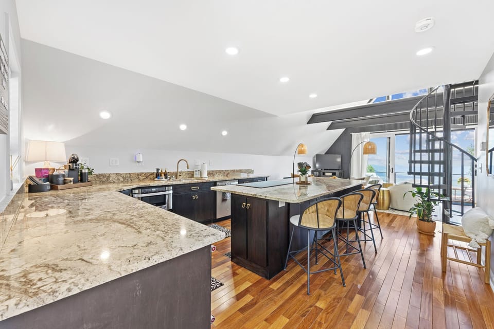 As you step through the door, you’re immediately greeted by an expansive open floor plan and soaring A-frame ceilings — a breathtaking first impression of the perfect balance between rustic charm and contemporary luxury.