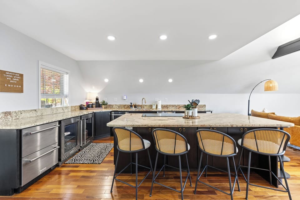 The quiet, high-performance dishwasher ensures you spend less time cleaning and more time enjoying your meal or wine-tasting experience. Its sleek design complements the kitchen's modern aesthetic.