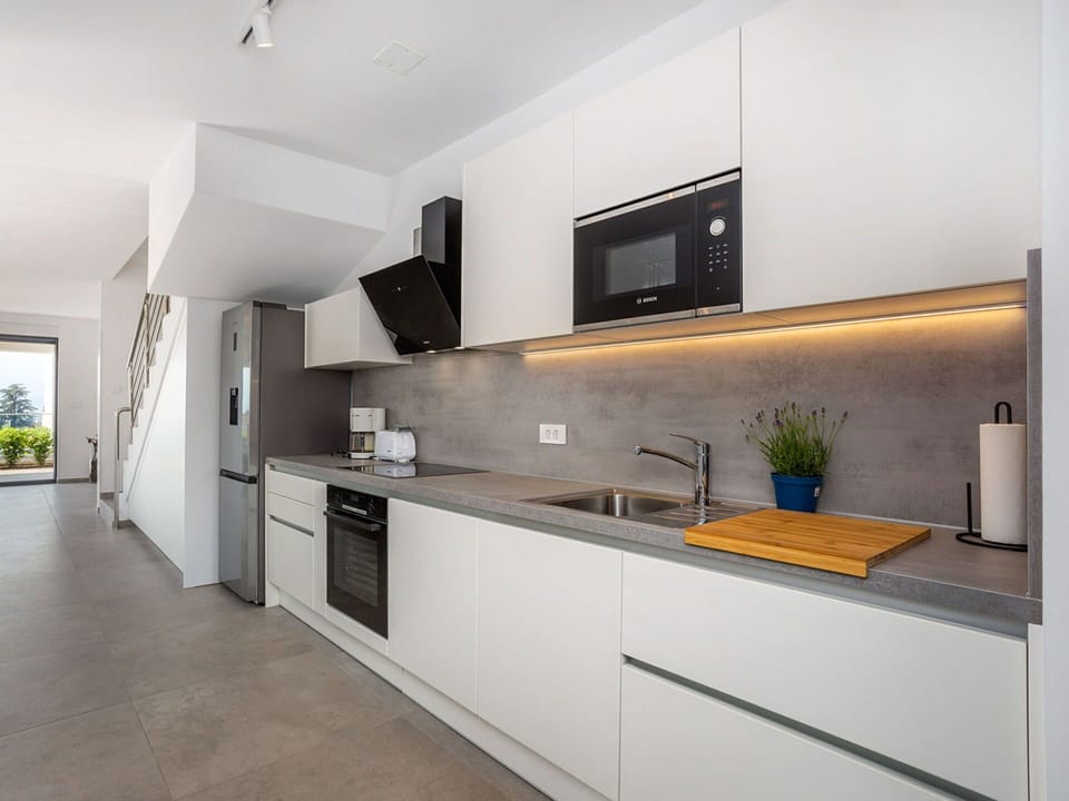 Kitchen, Countertop, Interior Design, Flooring, Cabinetry, Ceiling, Floor, Major Appliance, Kitchen Appliance, Home