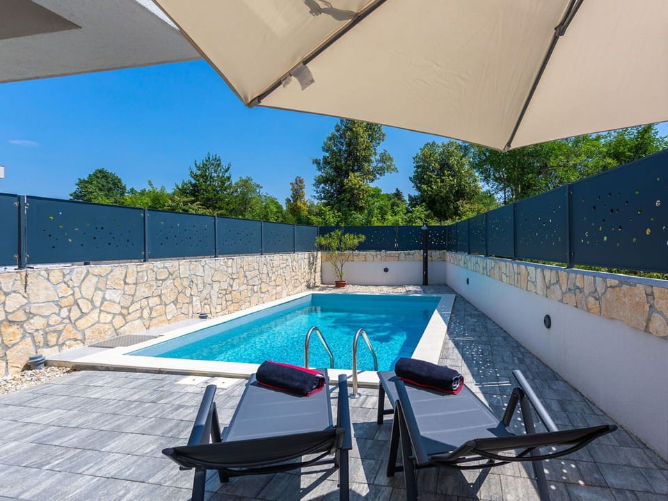 Swimming Pool, Blue, Outdoor Furniture, Resort, Composite Material, Shade, Tile, Chair, Flagstone, Sunlounger