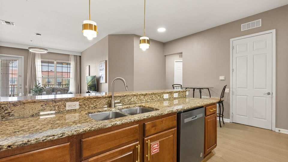 Fully equipped kitchen with silver appliances