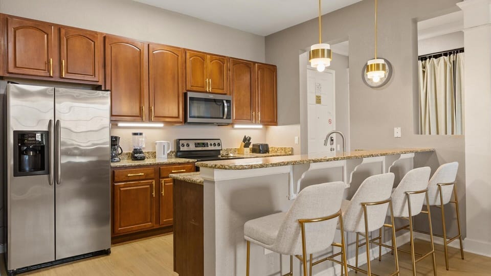 Fully equipped kitchen with stylish breakfast bar seating area