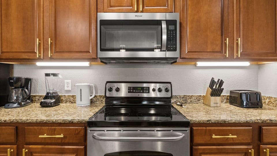 Fully equipped kitchen with silver appliances