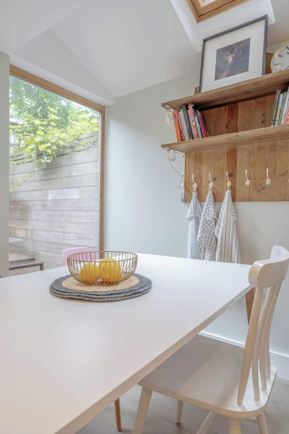 Ground floor - large space with a modern and fully equipped kitchen, a dining area, and a TV. Leads to the terrace at the back of the property