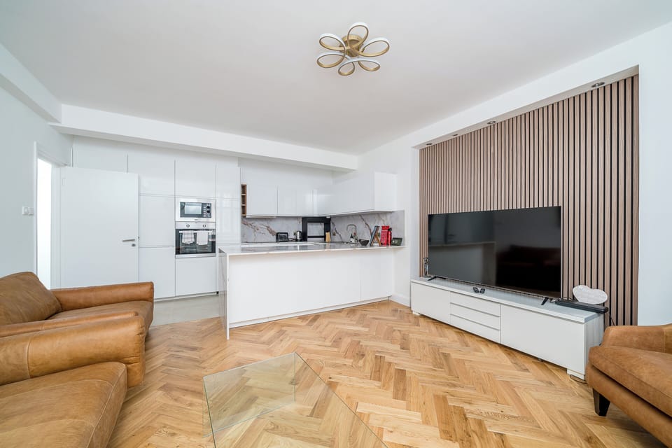 Luxury Apartment, City View | Living area | 27-inch LED TV with digital channels