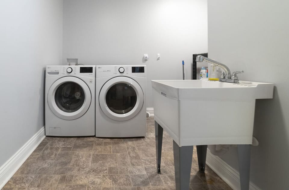 Laundry Room with utility sink available for guest use.