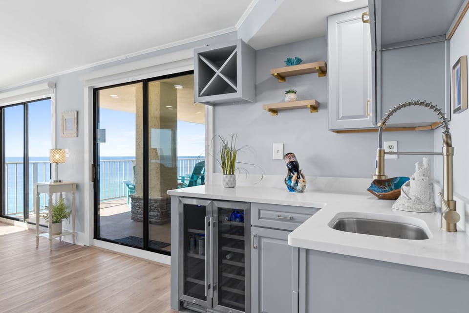 Whether you're starting your day with a fresh cup or winding down with a chilled glass of wine, this thoughtfully designed space adds a touch of luxury to your coastal stay.