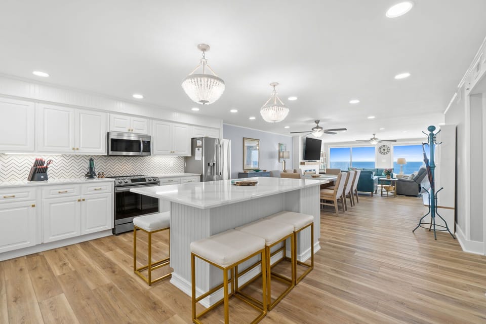The open-concept layout flows seamlessly into the living room, allowing guests to stay connected while cooking or entertaining