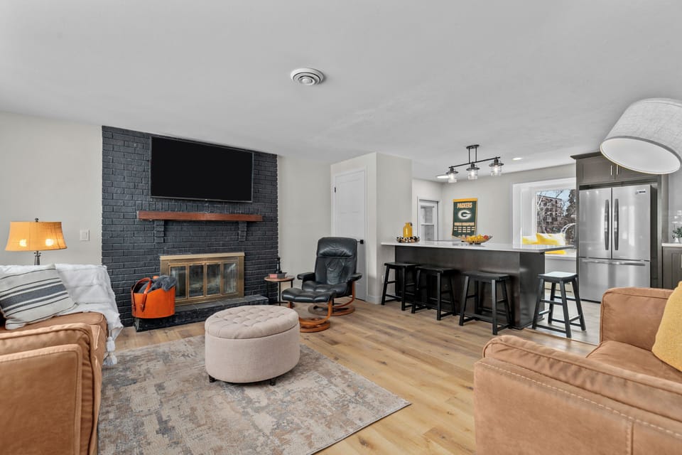 Cozy open concept living room/kitchen - excellent for unwinding after gameday!