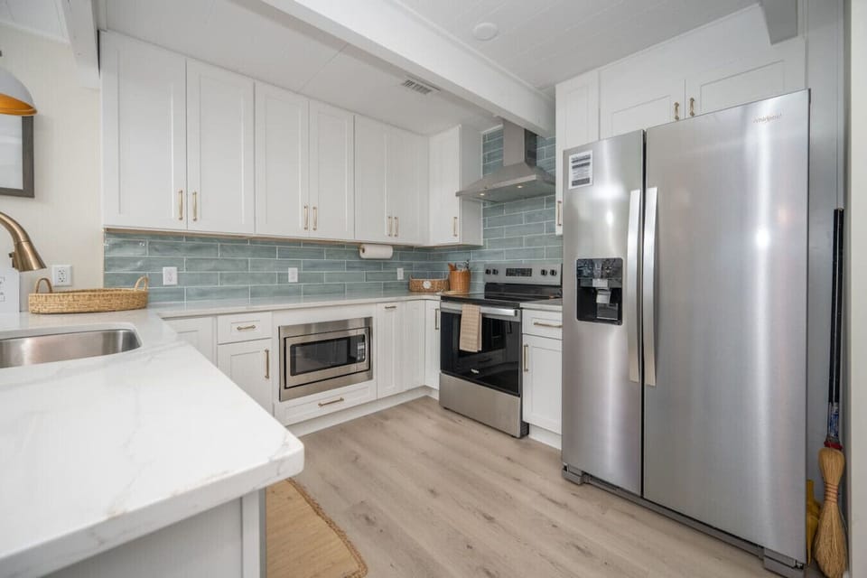 Spacious kitchen with modern appliances and all essentials for your convenience.