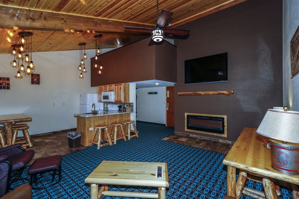 Family Suite, 3 Bedrooms, Kitchen | Living area | Flat-screen TV