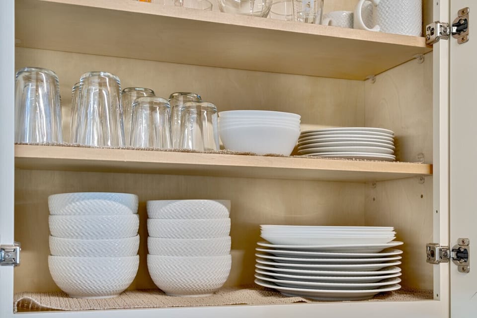 Stocked with dishes, glassware, and everything you need for home-cooked meals.