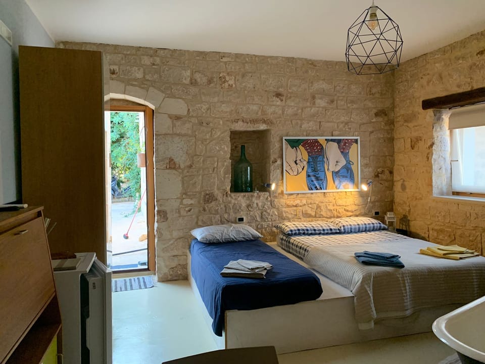 Family Quadruple Room, Garden View | Desk, soundproofing, iron/ironing board, free WiFi