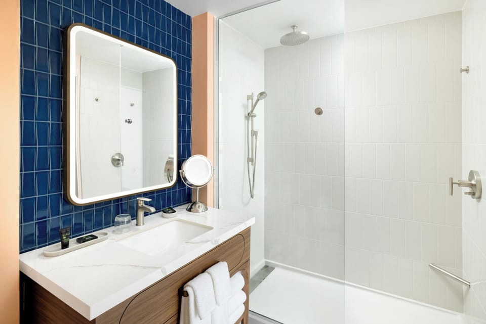 Rainfall showerhead, free toiletries, hair dryer, towels