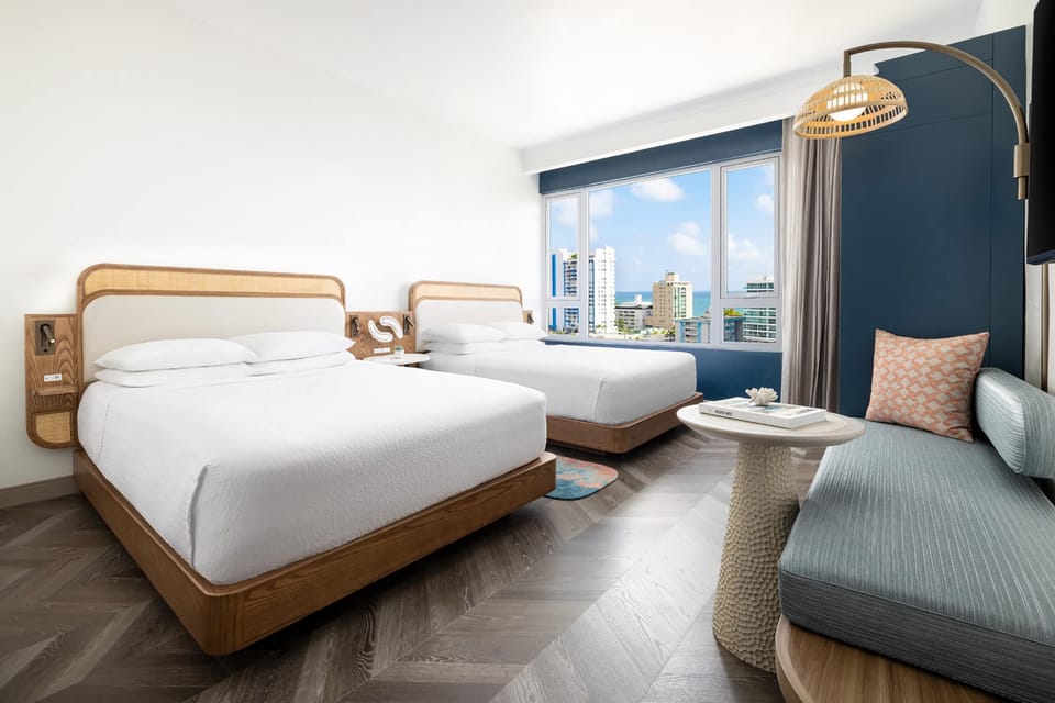 Room, 2 Queen Beds, Pool View | In-room safe, blackout drapes, soundproofing, iron/ironing board