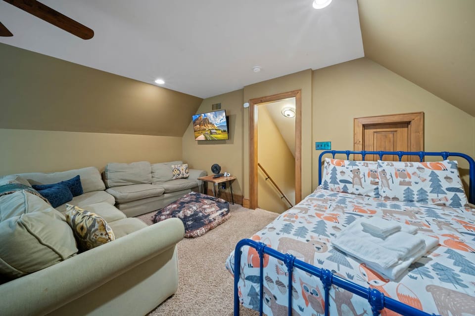 Upper Level Sleeping Area with Couch and TV