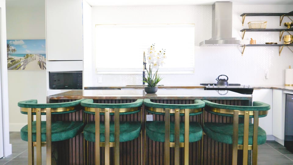 Large island with chic, comfy barstools for lounging