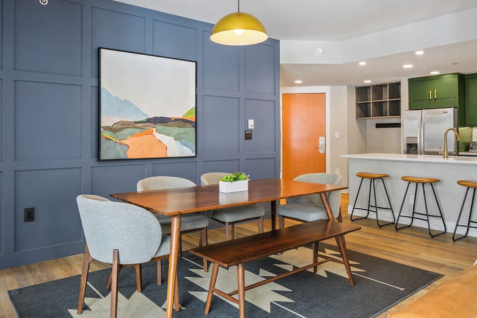 The dining area looks into the open kitchen