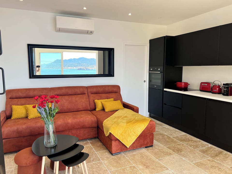 Living room (with sofa bed), TV, nesting tables, games, closets and a Kitchen