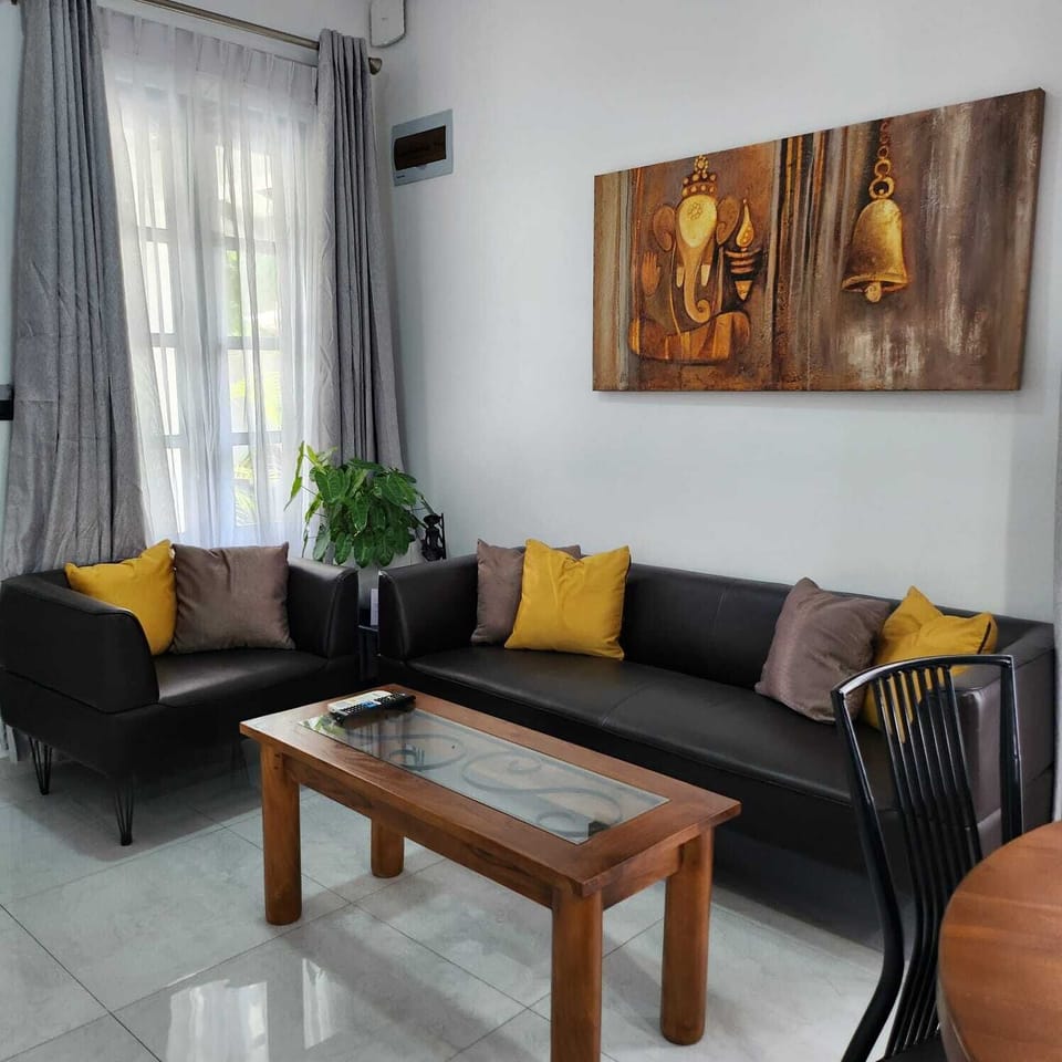 Deluxe Villa, Garden View | Living area | 32-inch flat-screen TV with digital channels, books, pay movies
