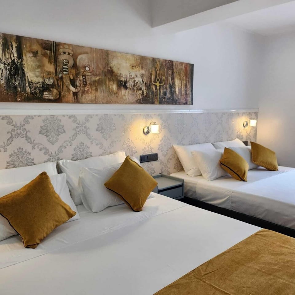 Deluxe Quadruple Room, City View | Premium bedding, down comforters, pillowtop beds, in-room safe