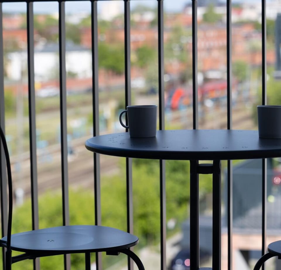 Balcony overlooking a peaceful part of Bydgoszcz – perfect spot for morning coffee or evening relaxation.