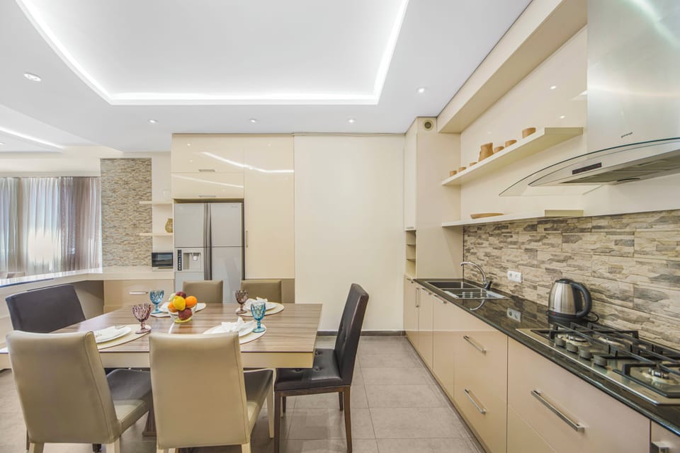 Exclusive Apartment, 3 Bedrooms, Non Smoking, Balcony | Private kitchen | Full-size fridge, microwave, oven, stovetop