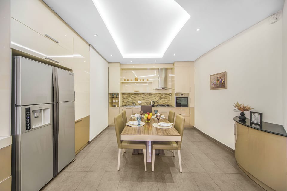Exclusive Apartment, 3 Bedrooms, Non Smoking, Balcony | Private kitchen | Full-size fridge, microwave, oven, stovetop