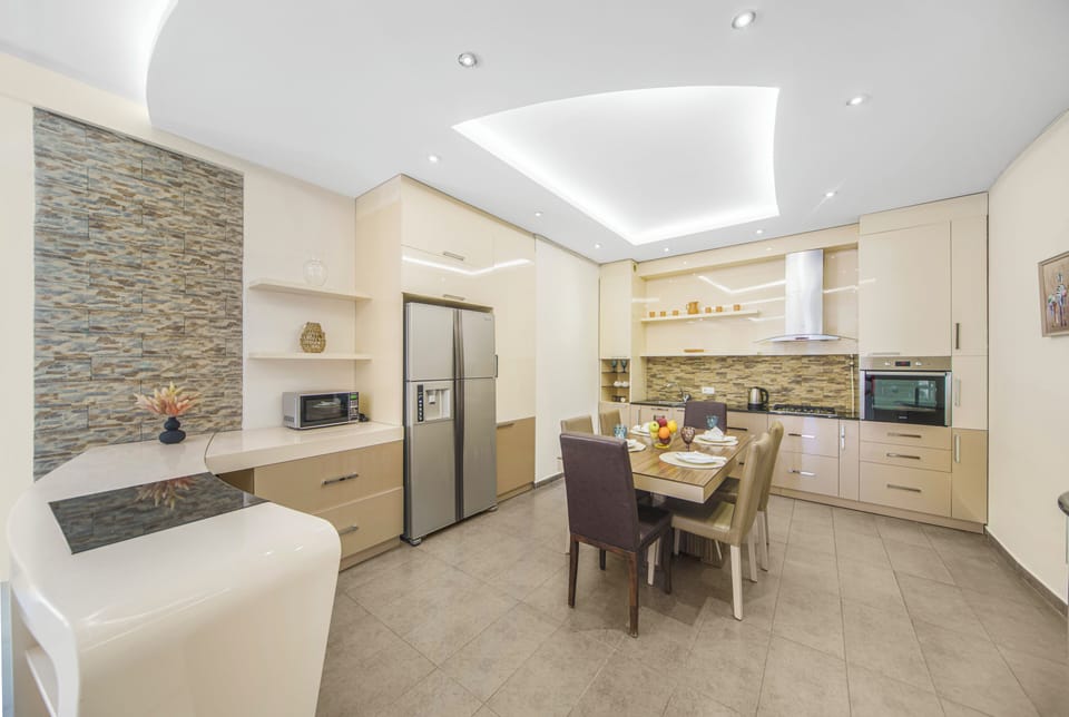 Exclusive Apartment, 3 Bedrooms, Non Smoking, Balcony | Private kitchen | Full-size fridge, microwave, oven, stovetop