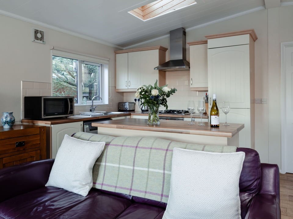 Furniture, Interior Design, Flooring, Room, Lighting, Ceiling, Floor, Cabinetry, Home, Kitchen Appliance