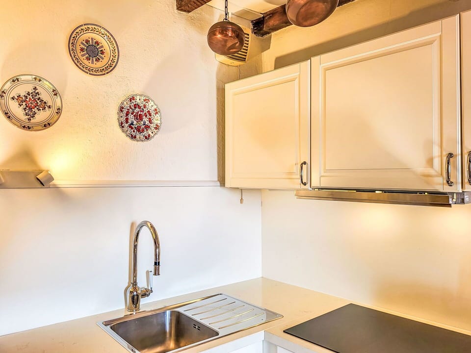 Countertop, Kitchen, Interior Design, Cabinetry, Wood, Kitchen Appliance, Light Fixture, Plumbing Fixture, Flooring, Yellow