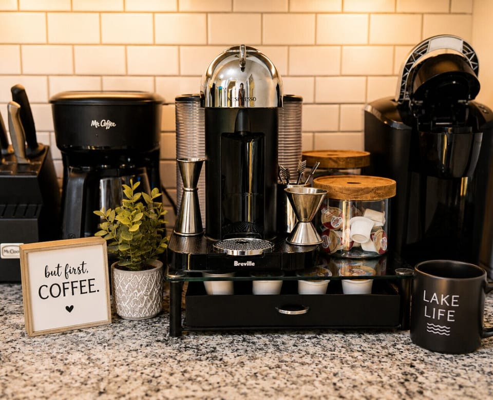 Start your mornings right with a fully stocked coffee bar featuring premium coffee makers, cozy lakehouse vibes, and everything you need for the perfect lakeside getaway.