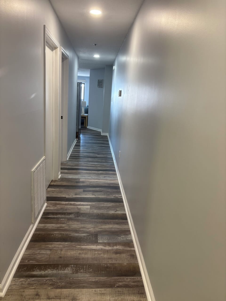 Hall and entryway to condo. 