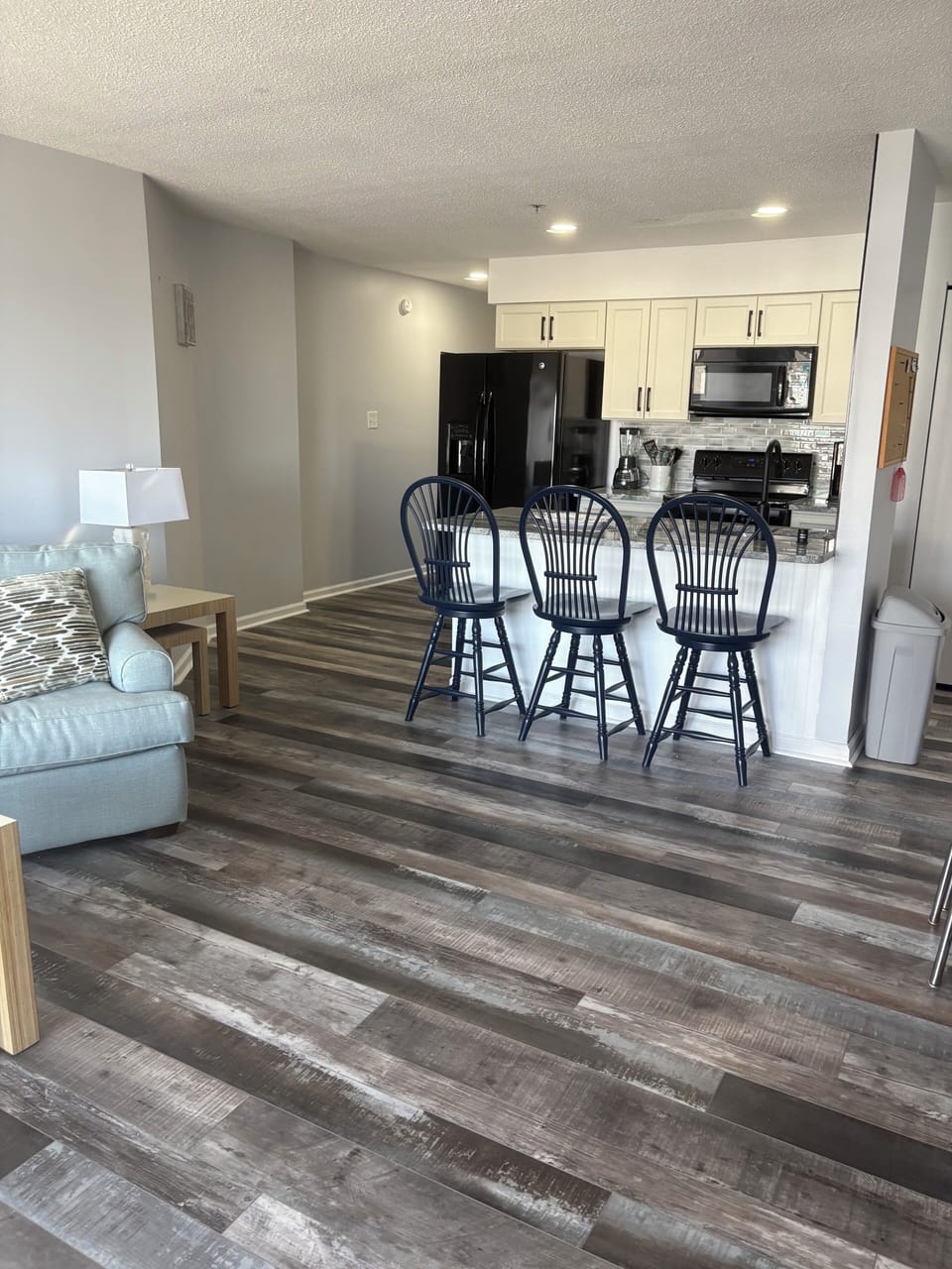 Kitchen and living room offer an open floor plan so you can enjoy quality time while cooking or making those cocktails! 