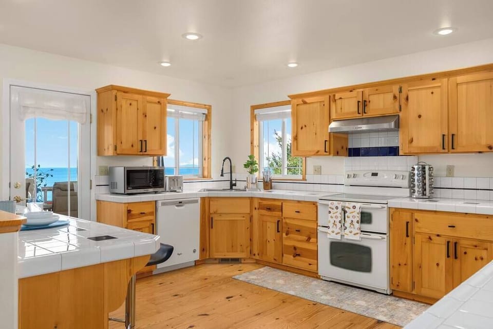 Kitchen with walk out door to the outdoor dining spaces