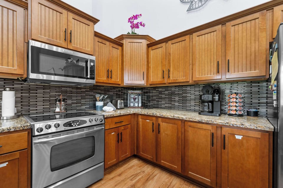 The inviting kitchen offers ample space & every home comfort