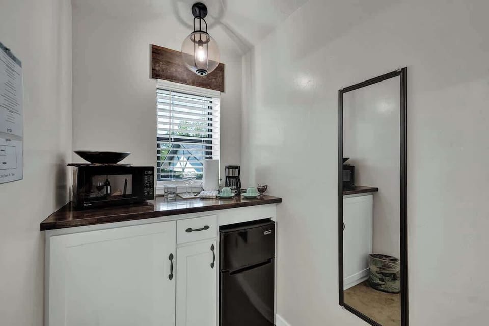 A microwave, coffee pot, and mini fridge are provided for your convenience