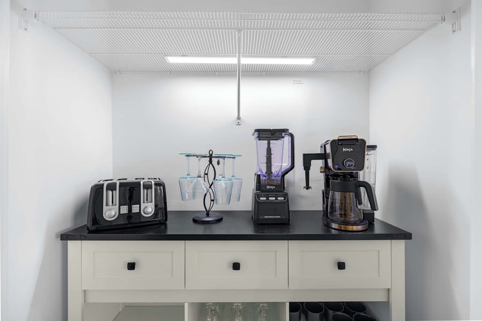 Coffee bar featuring a Ninja 2-in-1 coffee machine and other small appliances