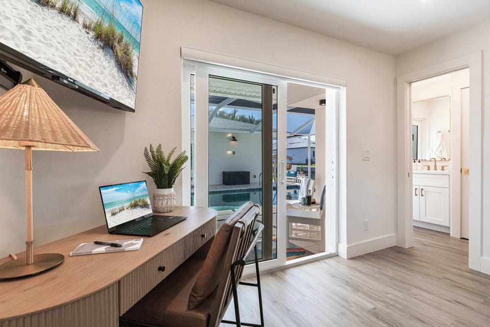 Sliding glass doors lead directly to the pool area, allowing you to easily step outside and enjoy the refreshing water or simply relax by the pool.
