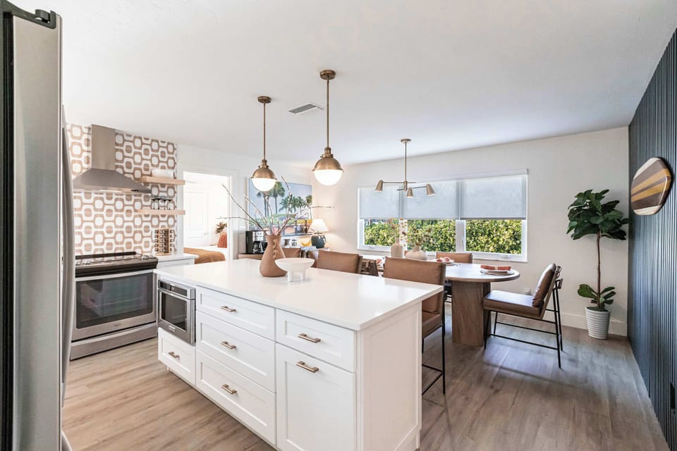 The open kitchen and dining area create a welcoming space for meals and gatherings