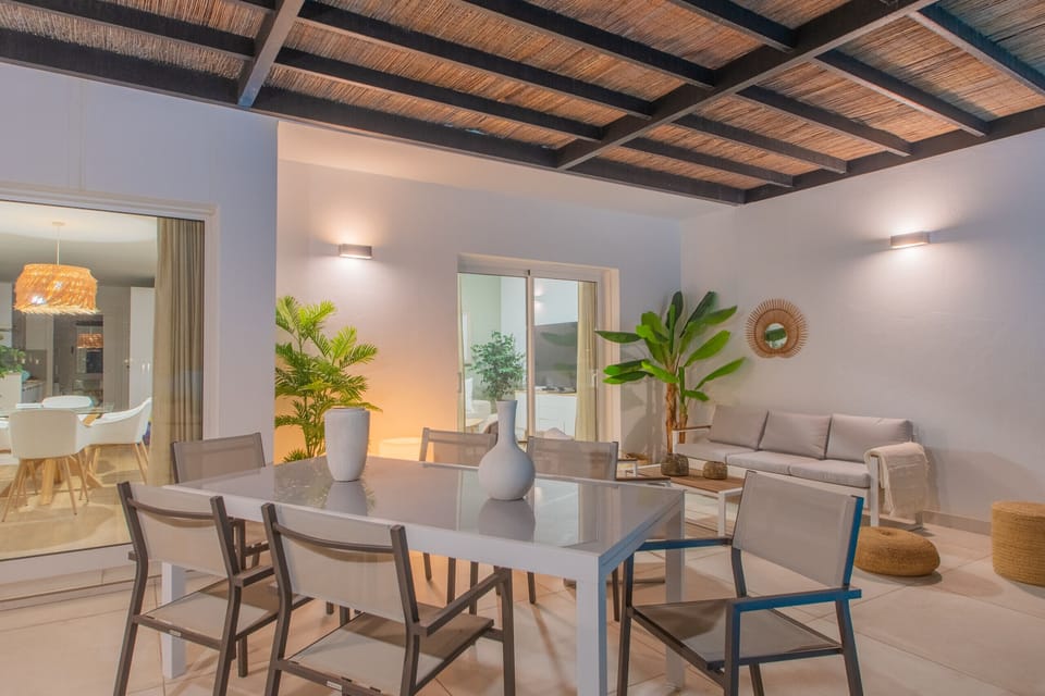 Spacious open-plan living-dining room with direct terrace access.