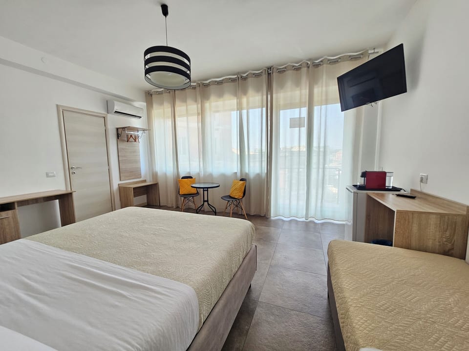 Triple Room, Housekeeping, City View | Desk, laptop workspace, free WiFi