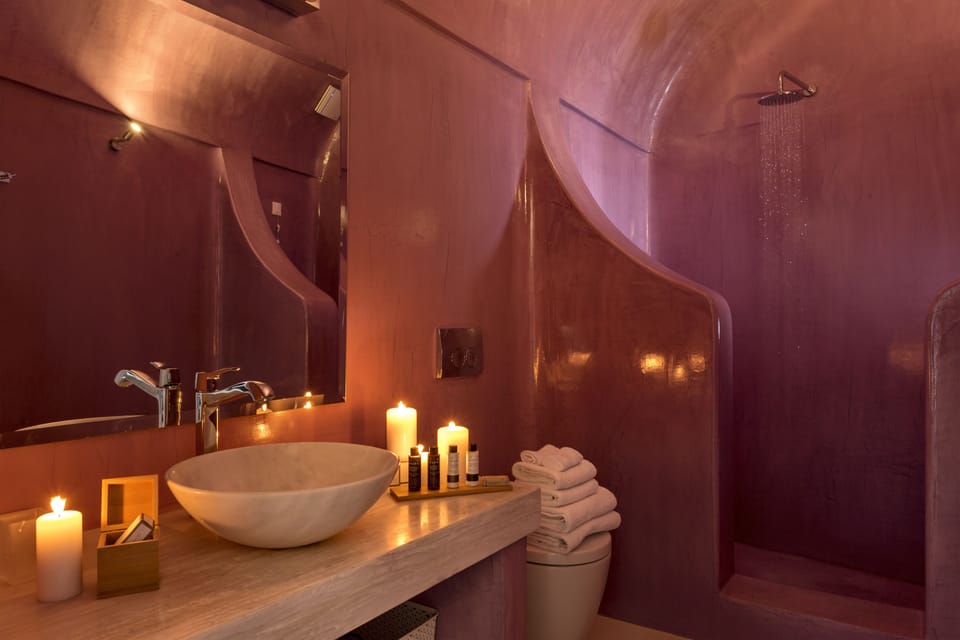 Shower, designer toiletries, hair dryer, towels