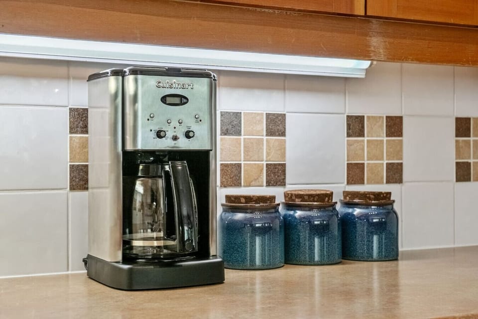 Full kitchen with a blender, slow cooker/crockpot, drip coffee machine, ground coffee, tea, sugar and basic condiments (ketchup, mustard and relish.)