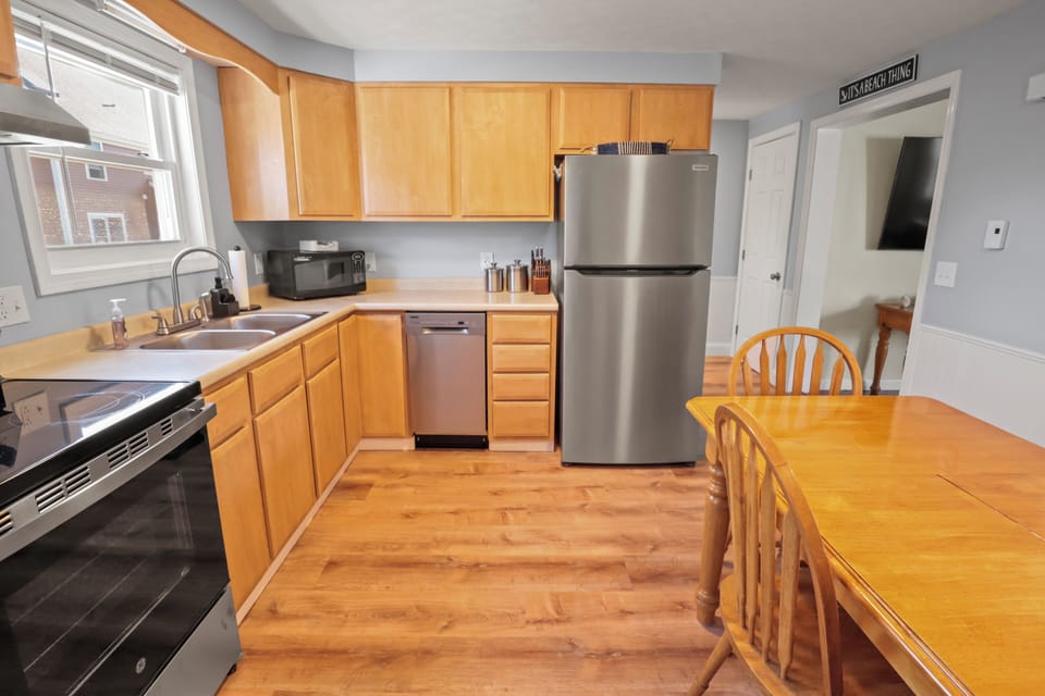 Fully equipped kitchen with coffee maker, cookware, and more for easy meals.