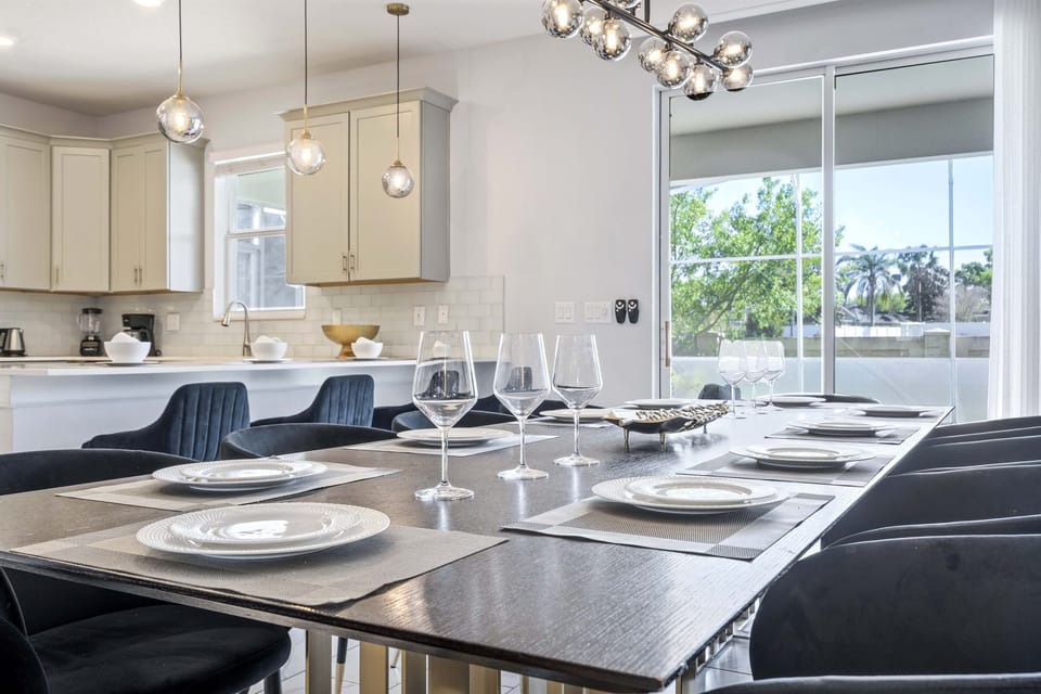 The dining room table seats 8 with additional 4 seats at the kitchen island.