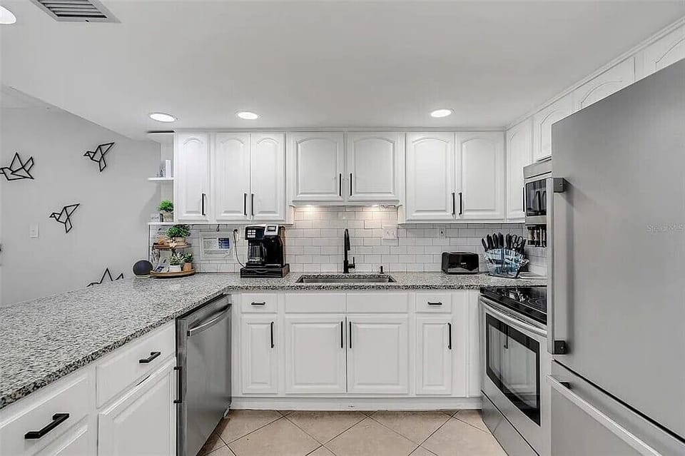 Fully stocked with stainless appliances, granite counters, and a Keurig for your morning brew.
