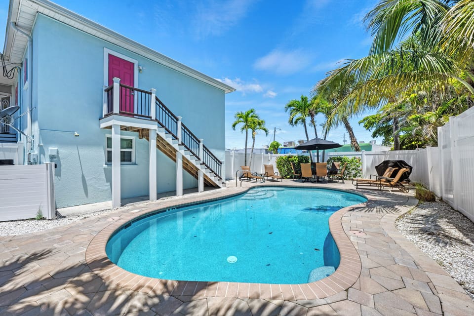 Lounge by the pool with your favorite book and a drink.