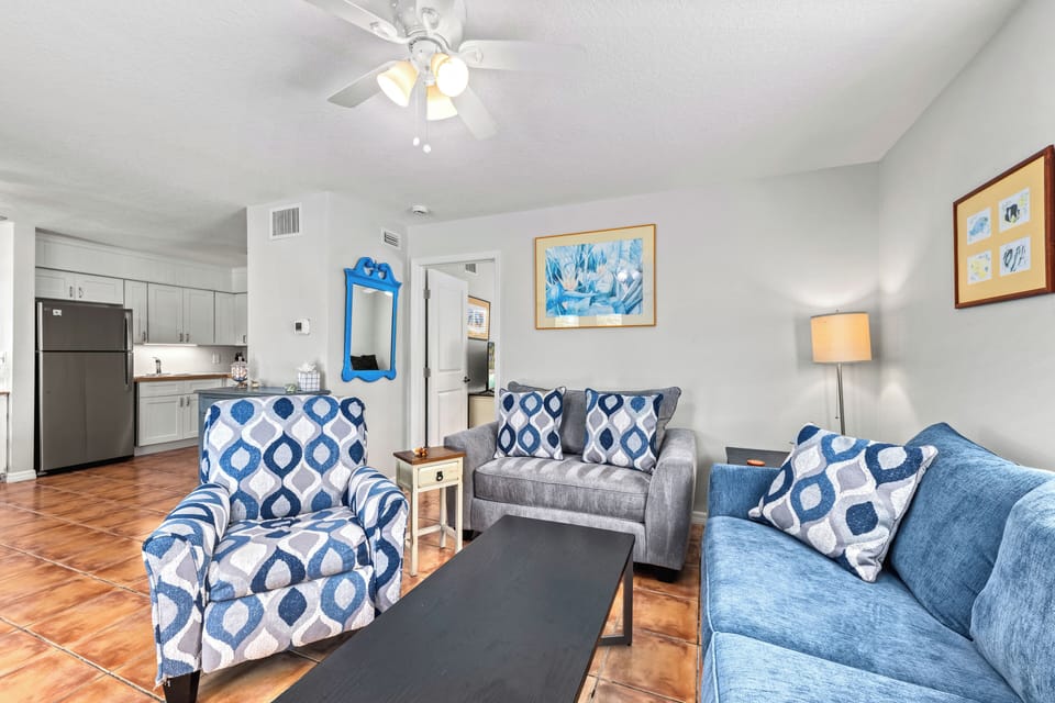 Living room with kitchen in the distance.